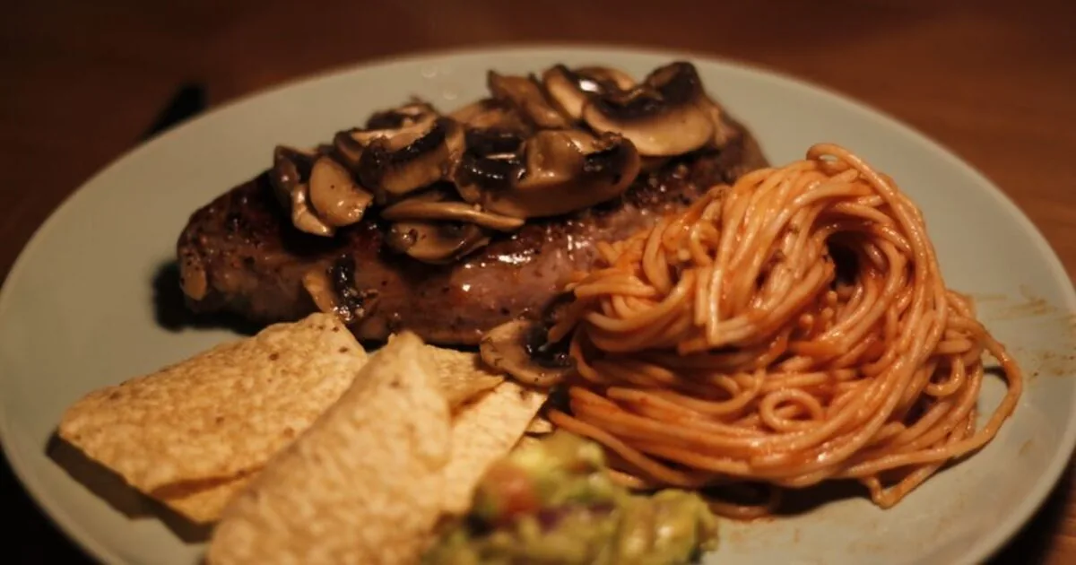 A plated steak dinner on a restaurant table